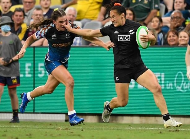 Portia Woodman of New Zealand fends off Jakiya Whitfeld of Oceania during the Oceania Sevens Challenge match between New Zealand and Oceania at...