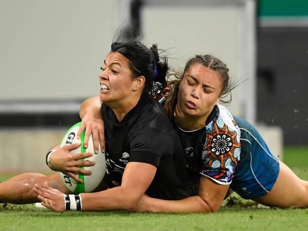 Stacey Waaka of New Zealand is tackled by Bienne Terita of Oceania during the Oceania Sevens Challenge match between New Zealand and Oceania at...