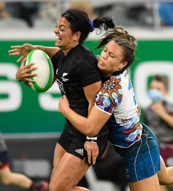 Stacey Waaka of New Zealand is tackled by Bienne Terita of Oceania during the Oceania Sevens Challenge match between New Zealand and Oceania at...