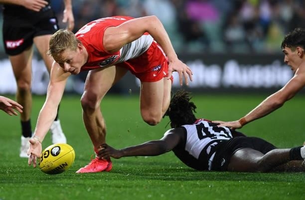 Isaac Heeney of the Swans competes with Martin Frederick of Port Adelaide during the round 15 AFL match between the Port Adelaide Power and the...