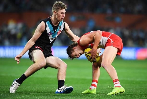 Todd Marshall of Port Adelaide competes with Jordan Dawson of the Swans during the round 15 AFL match between the Port Adelaide Power and the Sydney...