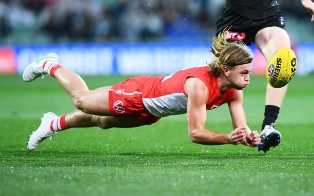 James Rowbottom of the Swans handballs during the round 15 AFL match between the Port Adelaide Power and the Sydney Swans at Adelaide Oval on June...