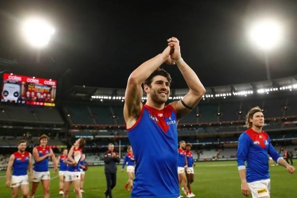 Christian Petracca of the Demons acknowledgers the fans after the round 15 AFL match between the Essendon Bombers and the Melbourne Demons at...