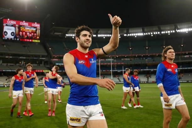 Christian Petracca of the Demons acknowledgers the fans after the round 15 AFL match between the Essendon Bombers and the Melbourne Demons at...