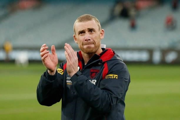 Simon Goodwin, Senior Coach of the Demons acknowledges the fans after the round 15 AFL match between the Essendon Bombers and the Melbourne Demons at...