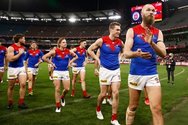 Max Gawn of the Demons leads his players off the ground after winning the round 15 AFL match between the Essendon Bombers and the Melbourne Demons at...