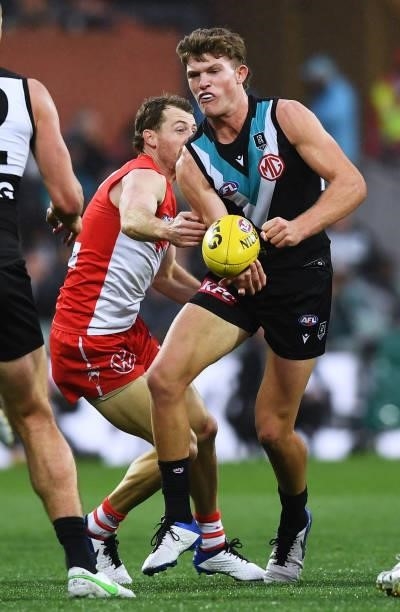 Mitch Georgiades of Port Adelaide handballs during the round 15 AFL match between the Port Adelaide Power and the Sydney Swans at Adelaide Oval on...