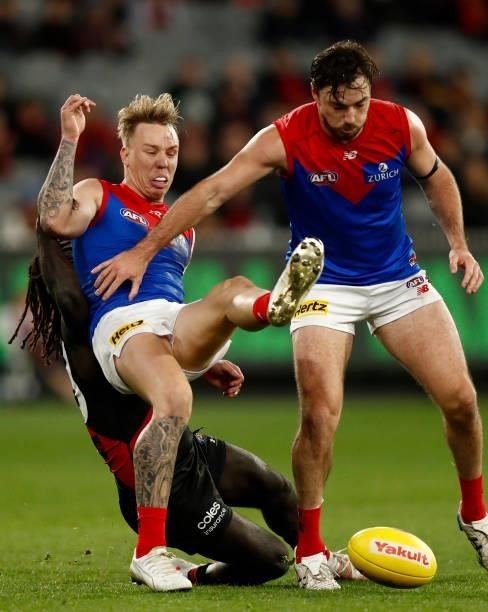 Anthony McDonald-Tipungwuti of the Bombers tackles James Harmes of the Demons during the round 15 AFL match between the Essendon Bombers and the...