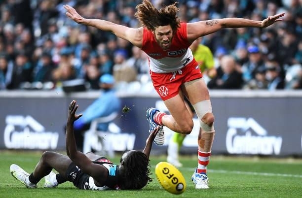 Martin Frederick of Port Adelaide competes with Tom Hickey of the Swans during the round 15 AFL match between the Port Adelaide Power and the Sydney...