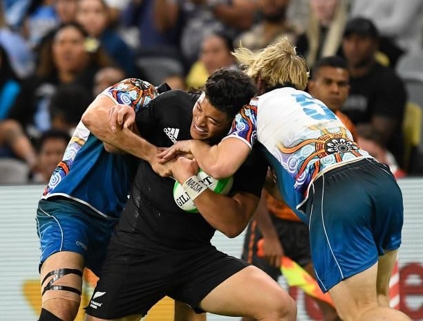 Tone Ng Shiu of New Zealand is tackled during the Oceania Sevens Challenge match between New Zealand and Oceania at Queensland Country Bank Stadium...