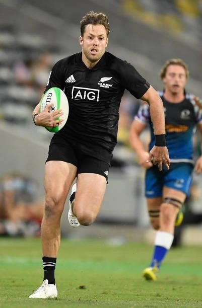 Tim Mikkelson of New Zealand runs to score a try during the Oceania Sevens Challenge match between New Zealand and Oceania at Queensland Country Bank...