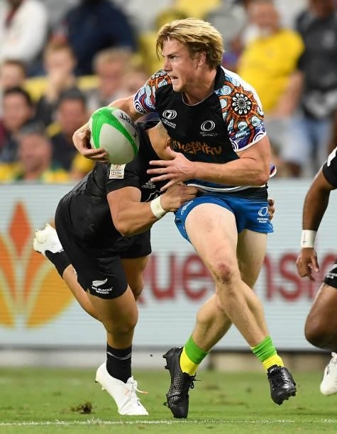 Angus Bell of Oceania is tackled by William Warbrick of New Zealand during the Oceania Sevens Challenge match between New Zealand and Oceania at...