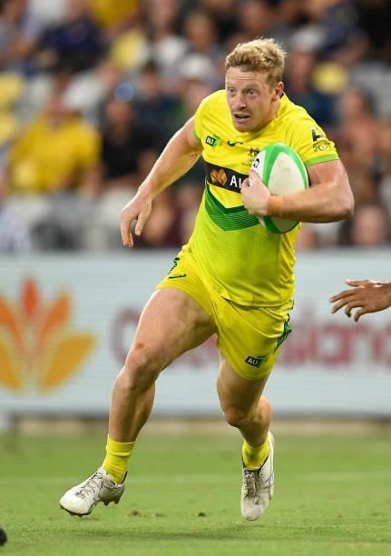 Lachlan Miller of Australia runs the ball during the Oceania Sevens Challenge match between Fiji and Australia at Queensland Country Bank Stadium on...