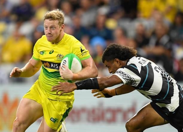 Lachlan Miller of Australia runs the ball during the Oceania Sevens Challenge match between Fiji and Australia at Queensland Country Bank Stadium on...