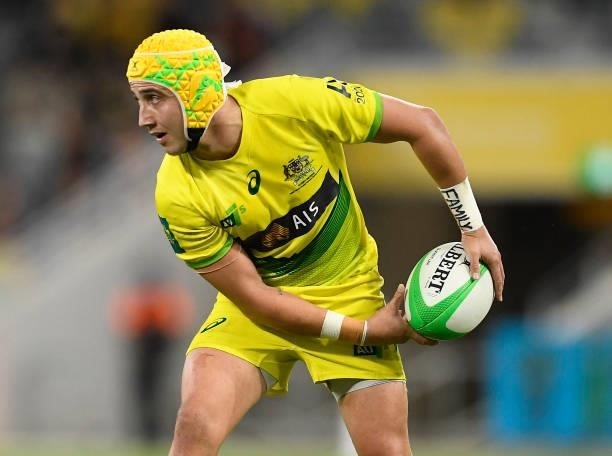 Josh Coward of Australia passes the ball during the Oceania Sevens Challenge match between Fiji and Australia at Queensland Country Bank Stadium on...