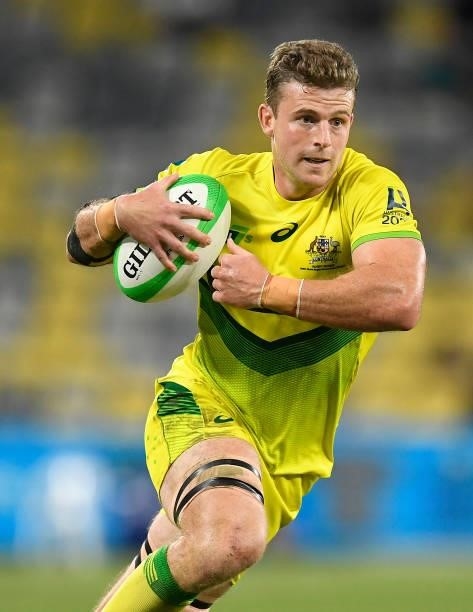 Nick Malouf of Australia runs the ball during the Oceania Sevens Challenge match between Fiji and Australia at Queensland Country Bank Stadium on...