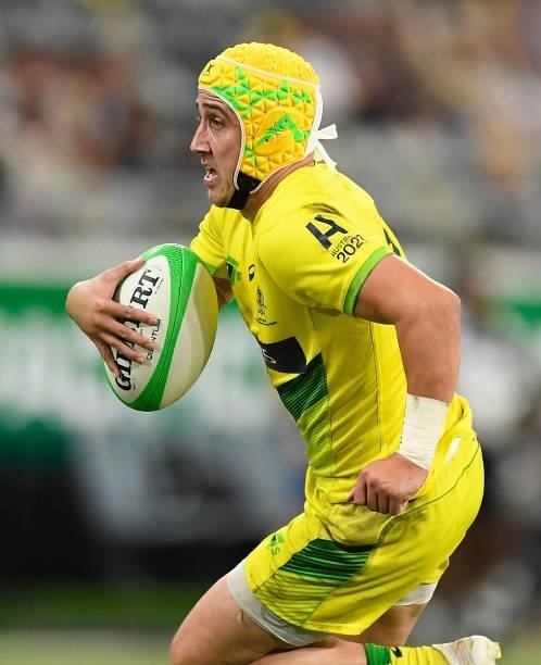 Josh Coward of Australia runs the ball during the Oceania Sevens Challenge match between Fiji and Australia at Queensland Country Bank Stadium on...