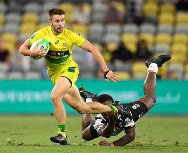 Josh Turner of Australia runs the ball during the Oceania Sevens Challenge match between Fiji and Australia at Queensland Country Bank Stadium on...