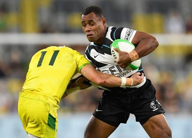 Livai Ikanikoda of Fiji is tackled by Josh Coward of Australia during the Oceania Sevens Challenge match between Fiji and Australia at Queensland...