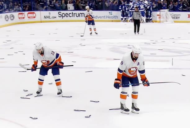 Mathew Barzal and Brock Nelson of the New York Islanders pause following a loss to the Tampa Bay Lightning in Game Seven of the NHL Stanley Cup...