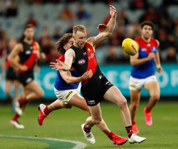 Nick Hind of the Bombers chases the ball during the round 15 AFL match between the Essendon Bombers and the Melbourne Demons at Melbourne Cricket...