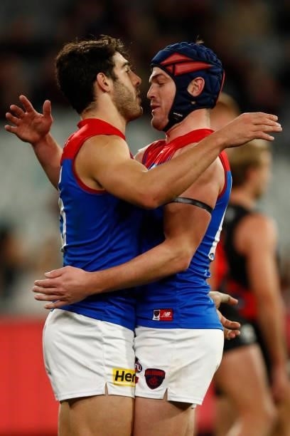 Christian Petracca and Angus Brayshaw of the Demons embrace during the round 15 AFL match between the Essendon Bombers and the Melbourne Demons at...