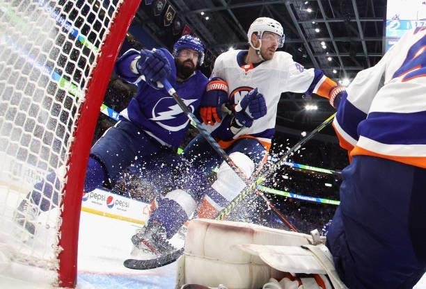 Alex Killorn of the Tampa Bay Lightning skates against Scott Mayfield of the New York Islanders in Game Seven of the NHL Stanley Cup Semifinals...