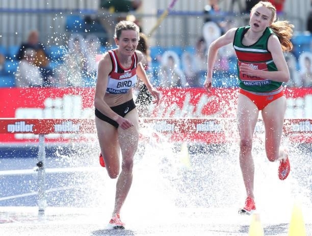 Elizabeth Bird of Shaftsbury Barnet leads Aimee Pratt of Sale over the water jump in the Womens 3000m Final during Day Two of the Muller British...