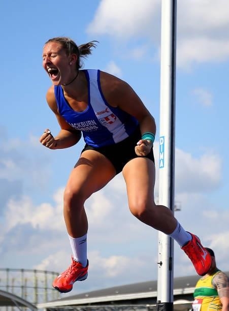 Holly Bradshaw of Blackburn celebrates after setting the new national record during the Womens Pole Vault Final on Day Two of the Muller British...