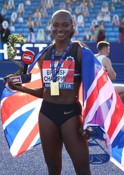 Dina Asher-Smith of Blackheath poses for photographs after winning the Womens 100m Final on Day Two of the Muller British Athletics Championships at...