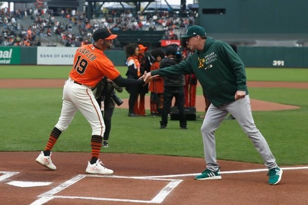 Managers Bob Melvin of the Oakland Athletics and Gabe Kapler of the San Francisco Giants shake hands before their game at Oracle Park on June 25,...