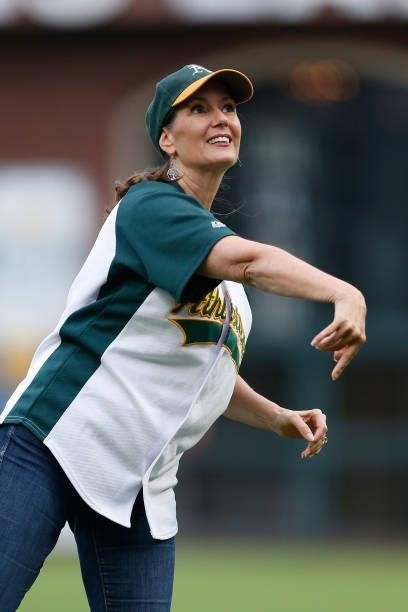 Mayor of Oakland Libby Schaaf throws out the ceremonial first pitch before the game between the San Francisco Giants and the Oakland Athletics at...