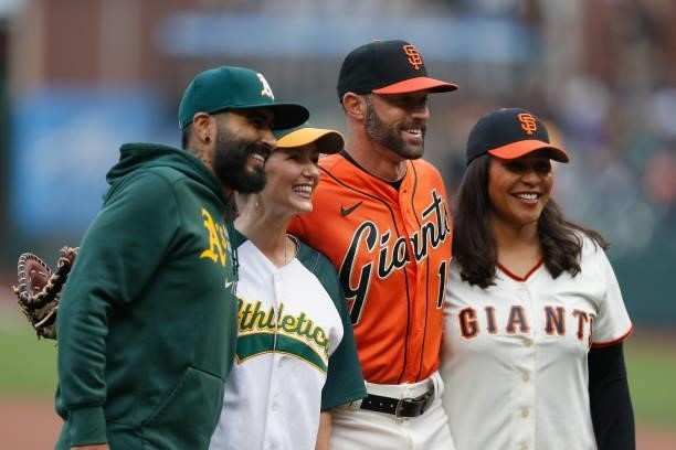 Mayor of San Francisco London Breed and Mayor of Oakland Libby Schaaf pose with Sergio Romo of the Oakland Athletics and Gabe Kapler of the San...