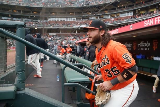 Brandon Crawford of the San Francisco Giants runs onto the field for the game against the Oakland Athletics at Oracle Park on June 25, 2021 in San...