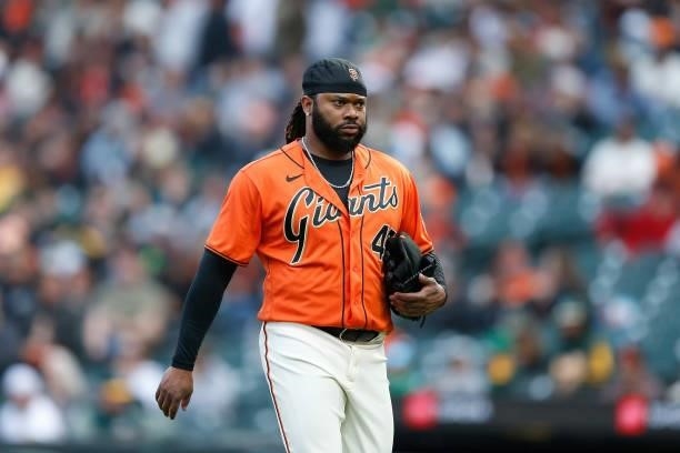 Pitcher Johnny Cueto of the San Francisco Giants looks on between innings against the Oakland Athletics at Oracle Park on June 25, 2021 in San...