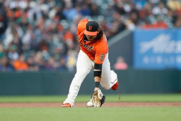 Brandon Crawford of the San Francisco Giants fields the ball against the Oakland Athletics at Oracle Park on June 25, 2021 in San Francisco,...