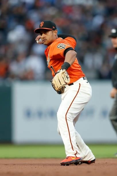 Donovan Solano of the San Francisco Giants fields the ball against the Oakland Athletics at Oracle Park on June 25, 2021 in San Francisco, California.