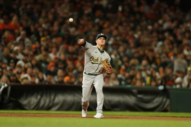 Matt Chapman of the Oakland Athletics fields the ball against the San Francisco Giants at Oracle Park on June 25, 2021 in San Francisco, California.