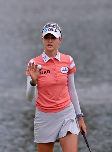 Nelly Korda reacts to her putt on the 18th green during the third round of the KPMG Women's PGA Championship at Atlanta Athletic Club on June 26,...