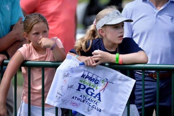 Young fans watch along the 18th green during the third round of the KPMG Women's PGA Championship at Atlanta Athletic Club on June 26, 2021 in Johns...