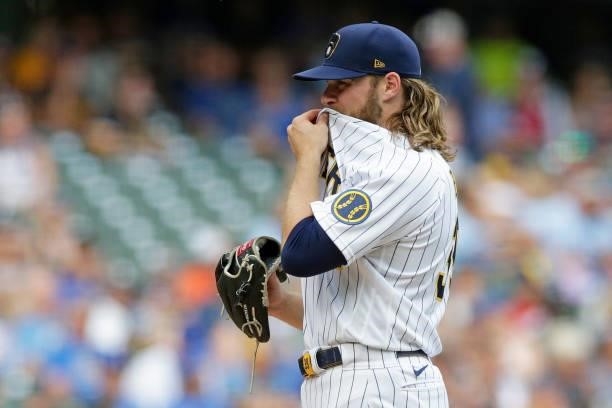 Corbin Burnes of the Milwaukee Brewers between pitches against the Colorado Rockies at American Family Field on June 25, 2021 in Milwaukee,...