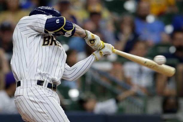 Picture of the ball compressed on the bat during the swing of Kolten Wong of the Milwaukee Brewers against the Colorado Rockies at American Family...