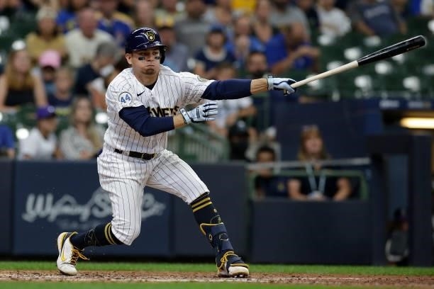 Luis Urias of the Milwaukee Brewers swings at a pitch against the Colorado Rockies at American Family Field on June 25, 2021 in Milwaukee, Wisconsin....