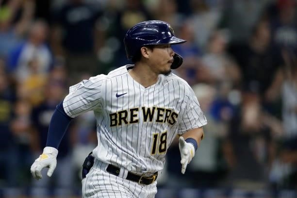 Keston Hiura of the Milwaukee Brewers hits a walk off sacrifice fly against the Colorado Rockies at American Family Field on June 25, 2021 in...