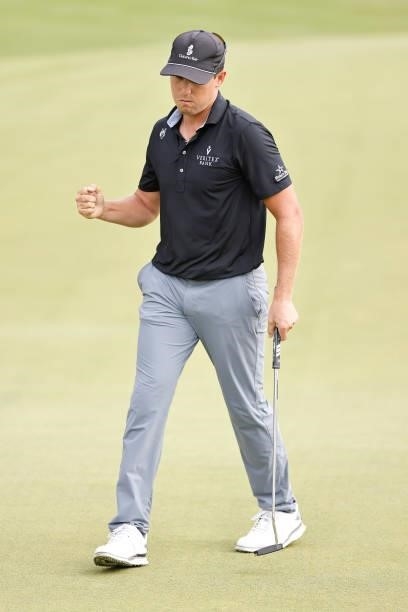 Kramer Hickok of the United States reacts to his birdie putt on the 15th green during the third round of the Travelers Championship at TPC River...