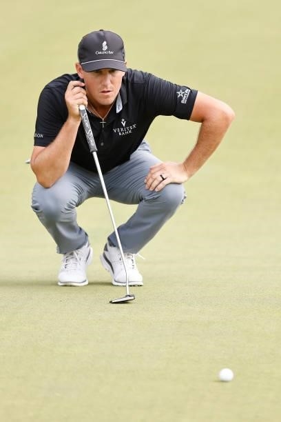 Kramer Hickok of the United States lines up a putt on the 15th green during the third round of the Travelers Championship at TPC River Highlands on...