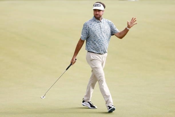 Bubba Watson of the United States reacts to his birdie putt on the 15th green during the third round of the Travelers Championship at TPC River...
