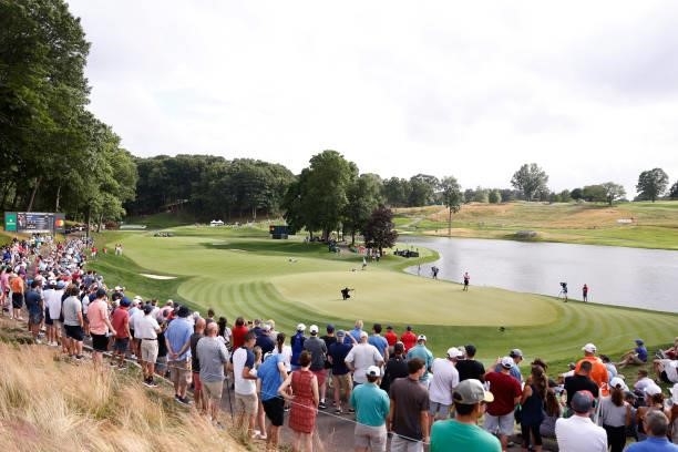 General view of the 15th green as Jason Day of Australia looks over a putt during the third round of the Travelers Championship at TPC River...