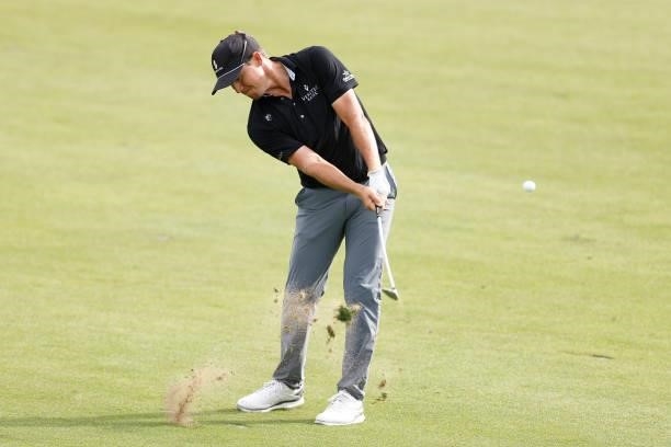 Kramer Hickok of the United States plays a shot on the 18th hole during the third round of the Travelers Championship at TPC River Highlands on June...