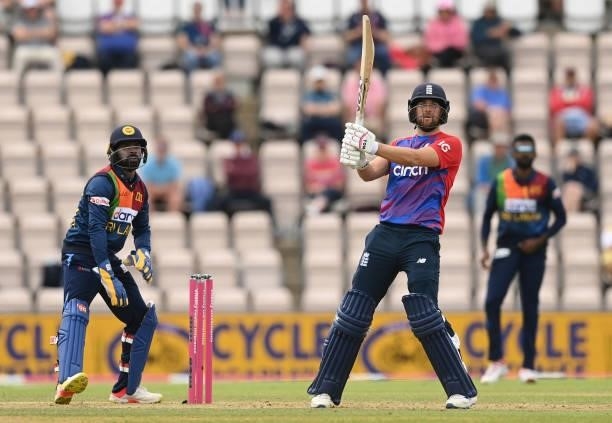 Dawid Malan of England hits a six watched by Niroshan Dickwella of Sri Lanka during the third T20 International between England and Sri Lanka at the...